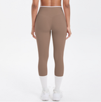 Mallas de yoga capri de cintura alta con bloques de color TCOMJFK001